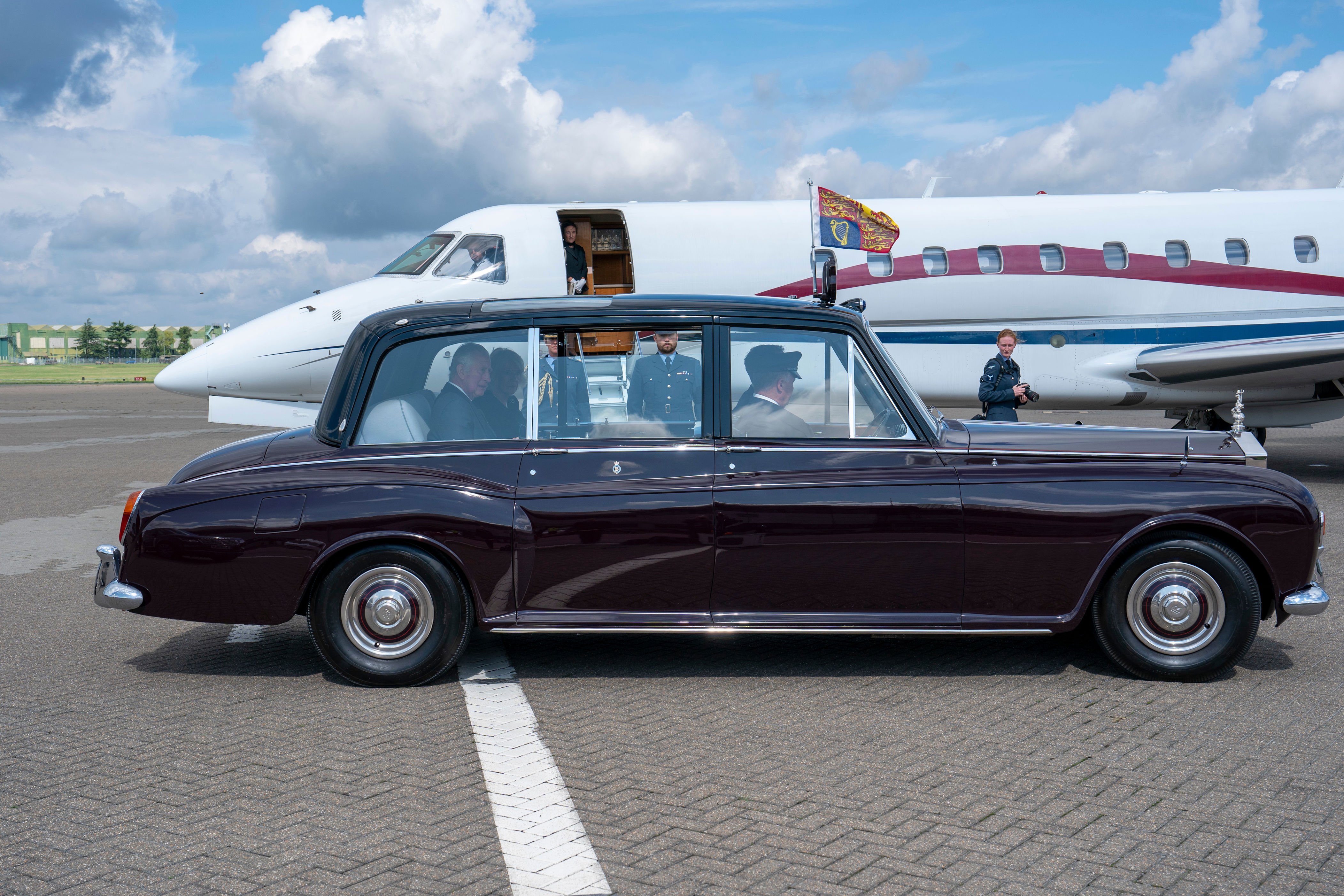 <p>King Charles III and Camilla, Queen Consort were photographed in a chauffeured car flying the Royal Standard -- the flag of Britain's sovereign -- after landing at RAF Northolt, a military and civilian airport outside London, on Sept. 9, 2022, as they returned to the capital from Scotland the morning after Queen Elizabeth II's <a href="https://www.wonderwall.com/celebrity/celebrities-dignitaries-react-to-death-of-queen-elizabeth-ii-647756.gallery">death</a>. It marked their first time in England as king and queen. </p>