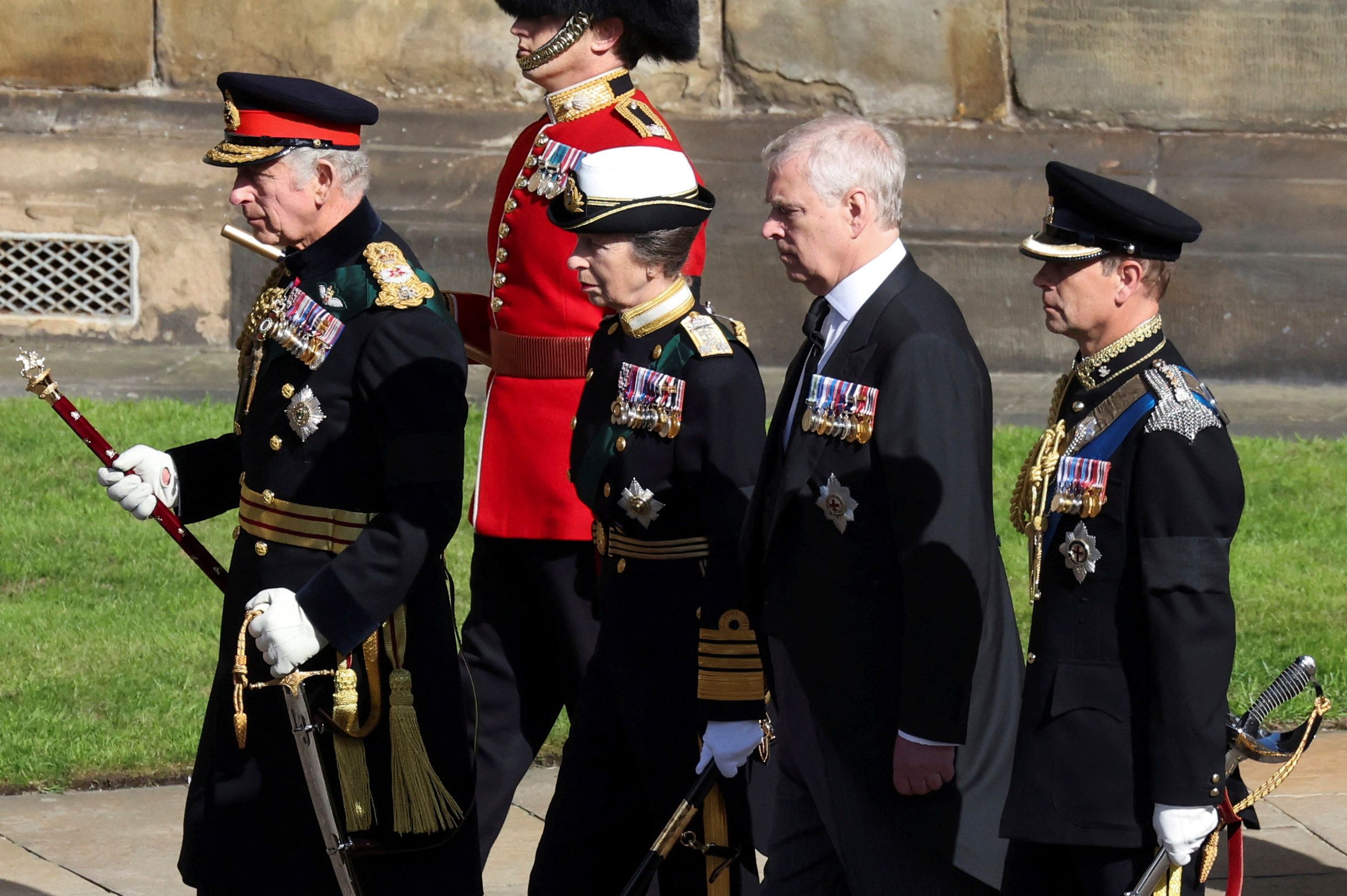 <p>Queen Elizabeth II's four children -- King Charles III, Princess Anne, Prince Andrew and Prince Edward -- walked behind the hearse carrying her coffin in Edinburgh, Scotland, on Sept. 12, 2022 -- four days after <a href="https://www.wonderwall.com/celebrity/celebrities-dignitaries-react-to-death-of-queen-elizabeth-ii-647756.gallery">her death at Balmoral</a> in the Scottish Highlands. Charles accompanied his mother's body in a solemn procession through the cobbled streets of the Scottish capital from the royal Palace of Holyroodhouse to St. Giles' Cathedral, where members of the public came to pay their respects before the queen's coffin headed to London for her funeral. Andrew, who served 22 years in the Royal Navy, was the only one of his siblings not in uniform -- though he did wear his medals -- as he was stripped of his military titles in early 2022 before settling a civil sexual abuse lawsuit.</p>