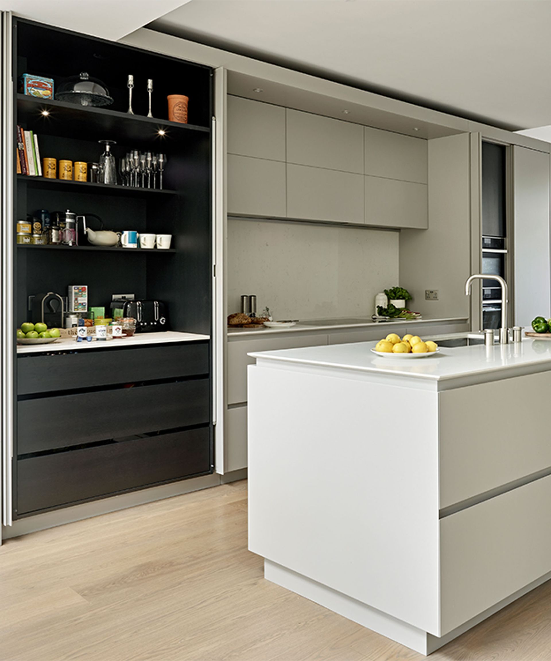 <p>                     Clean lines, clear surfaces and a calm aesthetic are key when it comes to modern kitchen design, so keeping clutter out of sight is a must.                    </p>                                      <p>                     Keeping appliances behind closed doors has long been a way of concealing those less-than-lovely items, such as dishwashers, refrigerators and washing machines in integrated cabinets. Breakfast stations are the latest modern kitchen concept that sees tea, coffee and toast-making essentials tucked tidily away into one zone.                    </p>                                      <p>                     A clever way of keeping must have items organised and in one place, pocket doors or bi folds neatly tuck out of the way for easy access when in use and then close and conceal the contents when breakfast is over.                   </p>                                      <p>                     ‘In the flurry of action in the mornings before work and school, it makes complete sense to have your favourite breakfast items organised and in one place to get the day off to an ordered, easy start,’ says Tom Howley, director of Tom Howley.                   </p>