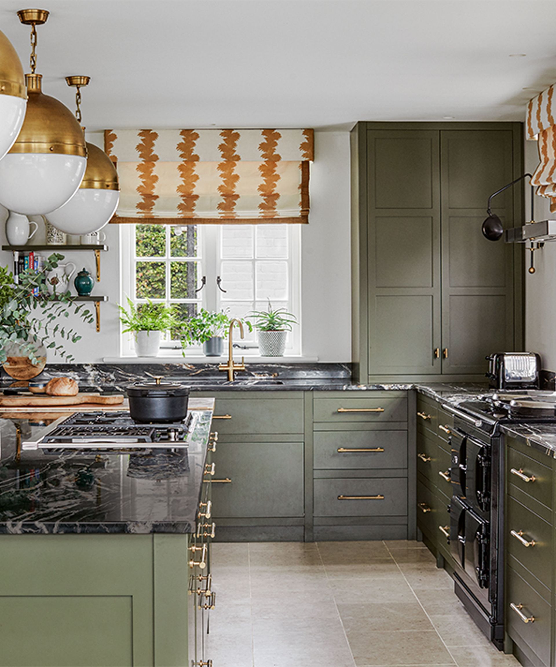 <p>                     Finishing details are key and can be an easy way of giving a plain-colored kitchen a luxe, modern touch. This classic olive green painted kitchen by RW Armstrong feels warm and grounded, but is given an extra dash of glamor by the addition of brass accents on lighting, handles, faucet and window blind fabric.                    </p>                                      <p>                     ‘Pure White is always on our bestsellers list but it’s been really interesting to see some newcomers which are full of confident color,’ says Dominic Myland, CEO of Mylands paints. ‘Messel No.39 is a new entry and is an intense rich olive and an interpretation of a color used by Oliver Messel the English artist and one of the foremost stage and screen designers of the 20th century.’                   </p>                                      <p>                     ‘We’ve seen greens in general surging in popularity over the last year,’ adds Dominic. ‘For homes that are decorated with palettes of greys, navy blue or red, olive green is a great tone to add warmth to an interior.’                   </p>