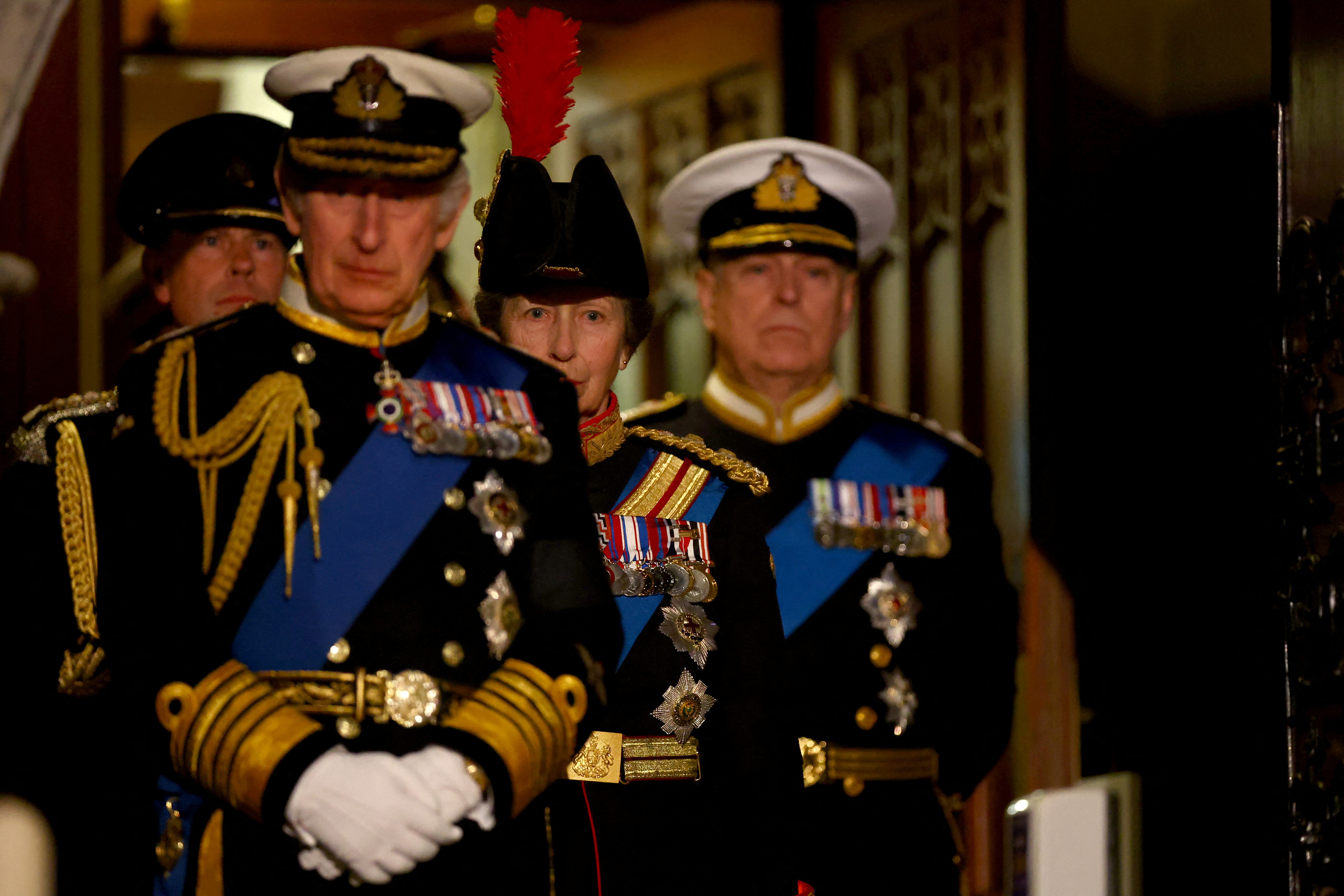 <p>Britain's King Charles III, Prince Edward, Princess Anne and Prince Andrew arrived to attend a vigil for their mother, Queen Elizabeth II, inside London's Westminster Hall on Sept. 16, 2022. Andrew, the Duke of York, was permitted to wear his naval uniform just for this event, despite previously having to step back as a working royal amid a scandal. After entering the vast hall, the late monarch's four children walked up the catafalque -- the raised platform upon which her casket rested -- and each stood on a different side of the coffin facing crowds of mourners walking past to pay their respects ahead of the queen's funeral on Sept. 19.</p>