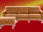 Burrow's leather Nomad sofa and ottoman on a red background