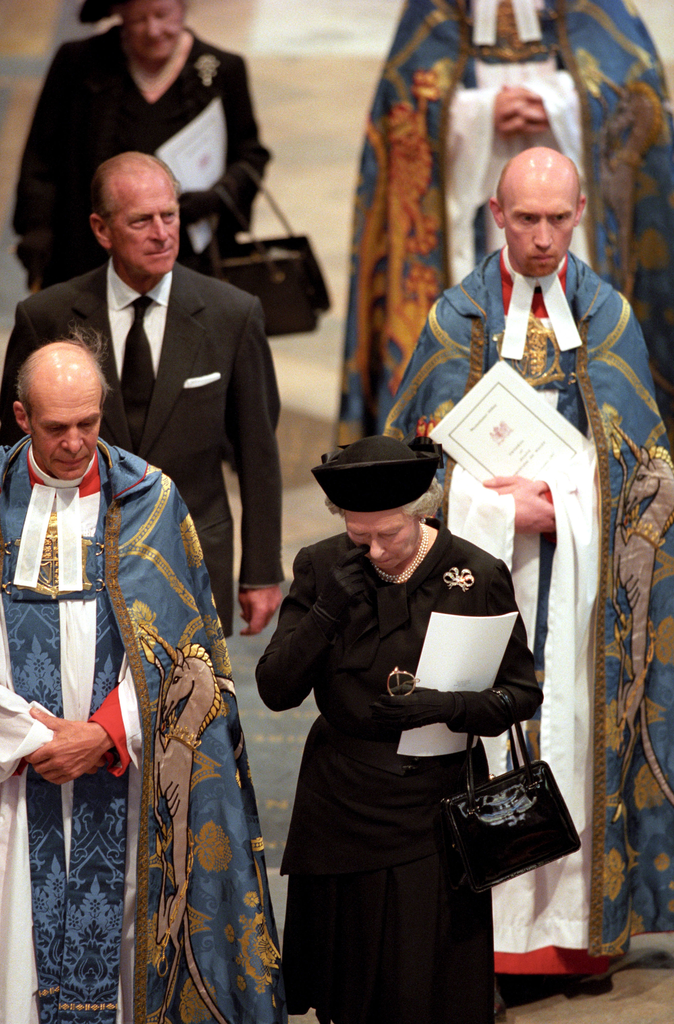 <p>Queen Elizabeth II wiped away a tear as she arrived at Westminster Abbey in London with senior clergy, Prince Philip and Queen Elizabeth the Queen Mother for the funeral of Princess Diana on Sept. 6, 1997.</p>