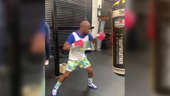 Floyd Mayweather shows off strength as he jabs punching bag