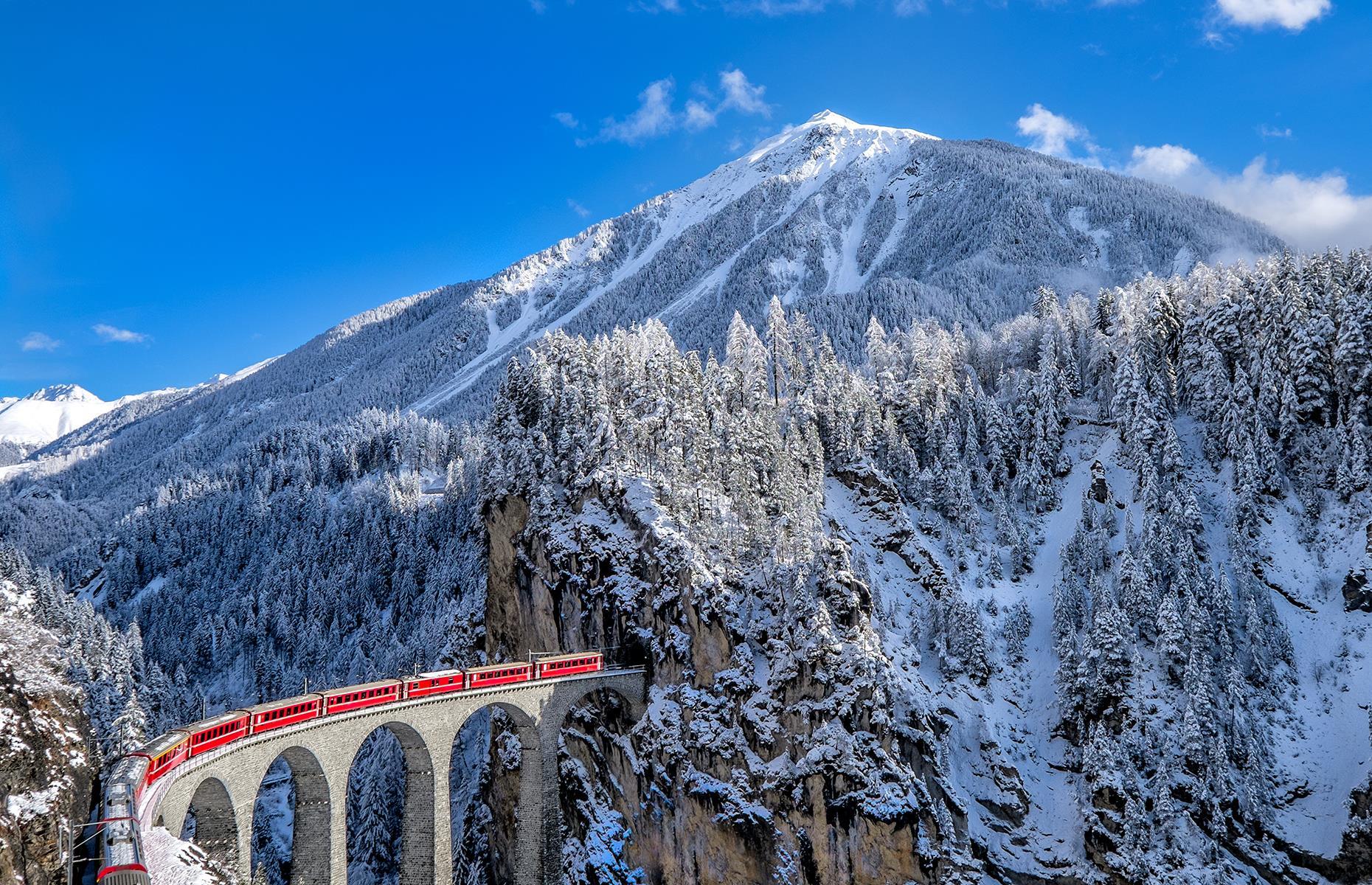<p>Connecting the mountain resorts of Zermatt and St Moritz, the <a href="https://www.glacierexpress.ch/en/">Glacier Express</a> is a brilliant way of seeing some of the most beautiful views in the Swiss Alps. The scenic route takes in sights including the Oberalp Pass, the highest point of the journey, and the Landwasser Viaduct (pictured) – a six-arch bridge which stands at 213 feet (65m) and plunges straight into a tunnel that leads through the mountain. </p>
