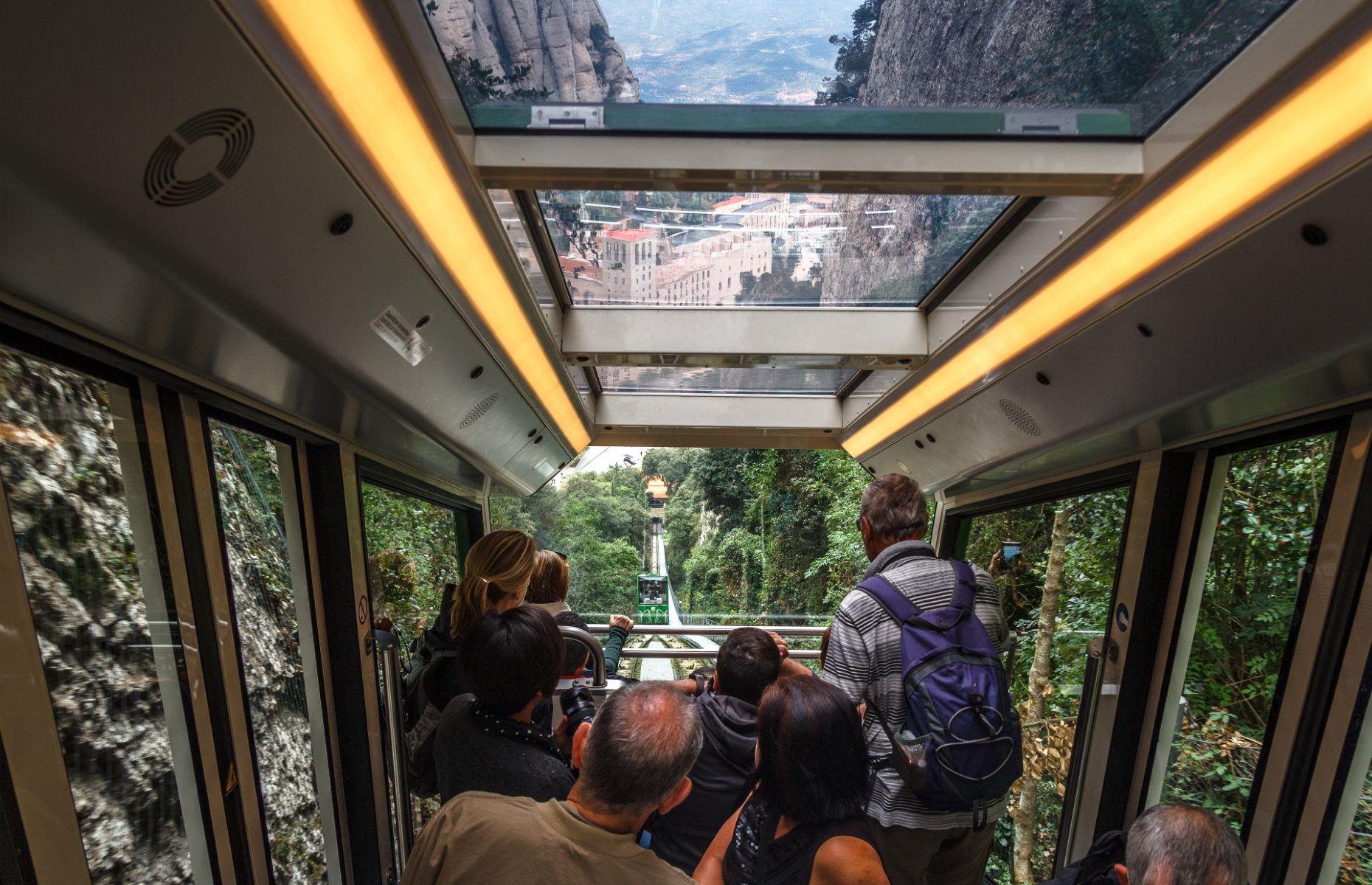 <p>A round-trip ticket, which includes either the Aeri or Cremallera option, costs $65 and takes around an hour and a half in total. If you want to go even higher, hitch a ride on the <a href="https://www.montserrat-tourist-guide.com/en/transport/funicular-sant-joan-montserrat.html">Saint Joan funicular</a> (pictured) which is included in the price of your ticket and takes you from the monastery right up to the top of the mountain.</p>