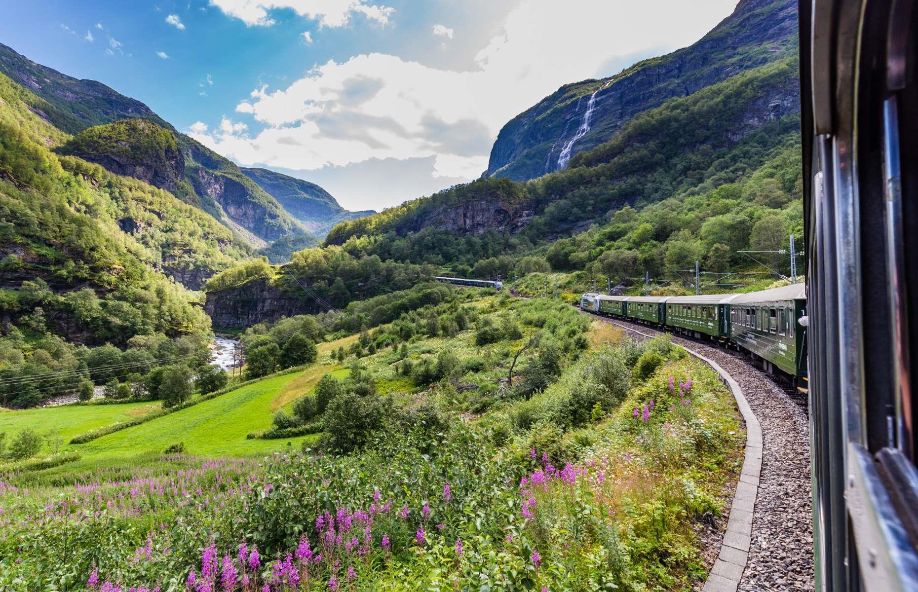 <p>Traveling between Myrdal and Flåm in western Norway, the <a href="https://www.norwaysbest.com/flamsbana/flamsbana---the-flam-railway/">Flåm Railway</a> is among the most historic and beautiful journeys in Europe. The route was built between 1923 and 1940 to serve villages along the Sognefjord. In fact, it’s one of the steepest rail journeys on the planet, dropping 2,844 feet (867m) during its 12-mile (20km) route, with 20 tunnels traveling through the steep mountains. Along the way, you’ll get to see everything from waterfalls to mighty lakes and mountains.</p>