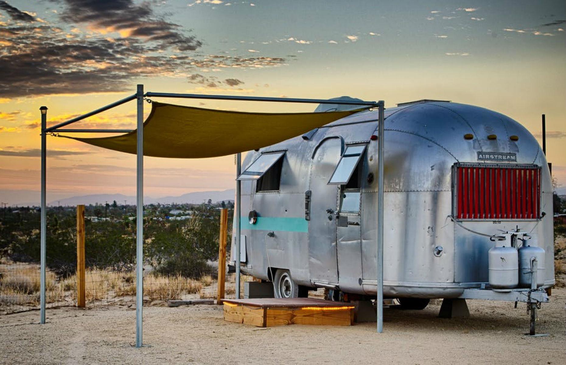 <p>This cute <a href="https://www.coolstays.com/property/kates-lazy-desert-airstreams/16867">Tiki Airstream</a> is 26 feet long and has one full bed, a bathroom and a small kitchenette. The overhauled Airstream has been designed to keep its owners cozy and comfortable, with air conditioning fitted for the warmer months and a space heater for winter. </p>