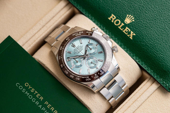 profit falls at watches of switzerland but rolex seller maintains guidance