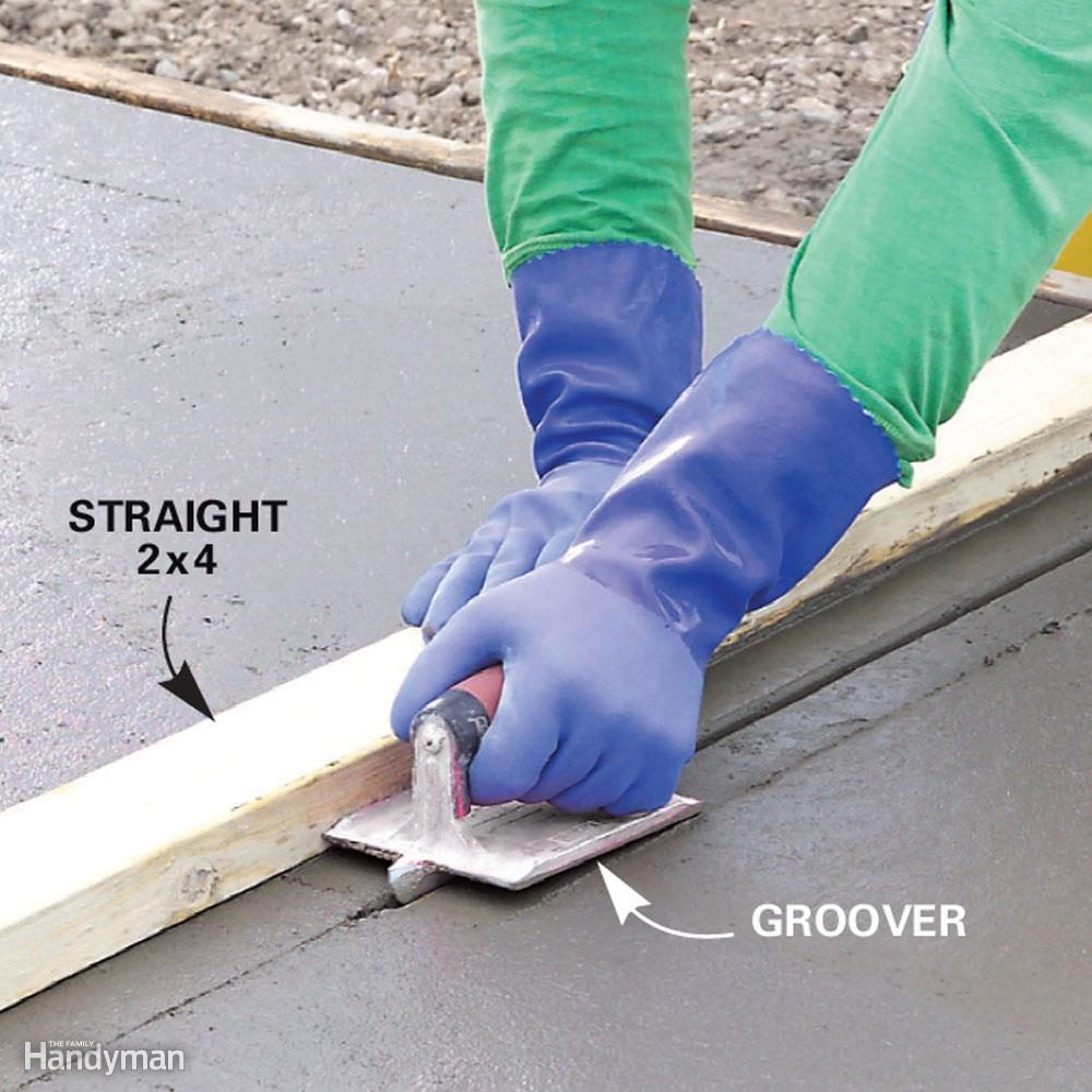 <div class="tip"> <div class="tip-content"> <p>Concrete driveways are going to crack. <a href="https://www.familyhandyman.com/project/how-to-pour-concrete/">Control joints</a> provide a weakened line that encourages the cracks to form where you won't see them. For a 5-in.-thick slab, control joints should be added in a pattern of squares no larger than about 10 ft. The joints should be at least 1-1/4 in. deep to be effective. Some contractors use a tool to cut the joints while the concrete is wet. Others return to cut the joints with a saw after the concrete sets.</p> <h3>Will You Apply Curing Compound After You Finish the Driveway?</h3> <p>Concrete needs to cure for about a week to approach full strength. During this time, evaporation of the water in the concrete has to be slowed to allow proper curing. Misting the slab or covering it with wet burlap or plastic sheeting are two methods of slowing evaporation. But applying a liquid, membrane forming curing compound to just-finished concrete is better because it doesn't require constant vigilance to succeed.</p> </div> </div>