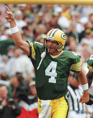 FILE - Green Bay Packers quarterback Brett Favre reacts after throwing a second quarter touchdown pass to William Henderson Sunday, Sept. 15, 1996, against the San Diego Chargers in Green Bay, Wis.