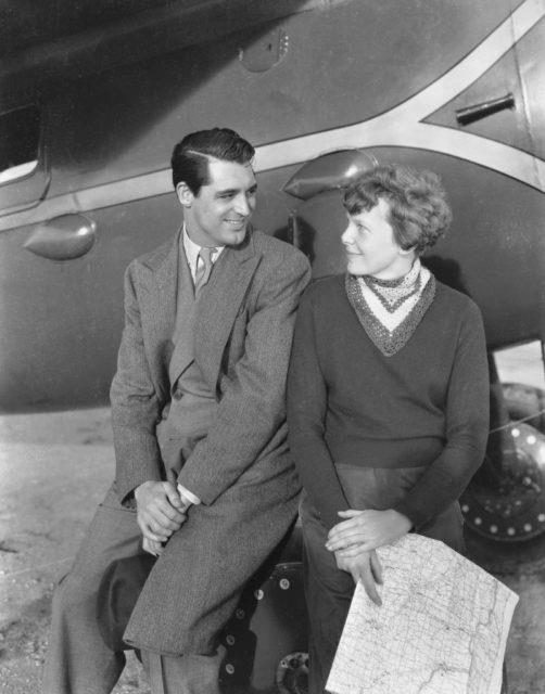 <p><span>Arguably the most famous female aviator in history, Amelia Earhart visited Cary Grant on the set of his 1935 film </span><i><span>Wings in the Dark. </span></i><span>The movie revolved around a female aviator who is drawn to a flying ace and inventor, played by Grant. </span></p> <p><span>The female aviator, played by Myrna Loy, was supposed to be loosely based on Earhart herself. It’s no wonder, then, that during filming Earhart was </span><a href="https://en.wikipedia.org/wiki/Wings_in_the_Dark" rel="noopener"><span>invited to the set</span></a><span> to act as a consultant. Although Grant and Earhart met on set, and posed for a number of photos, there is very little else known about their meeting.</span></p>