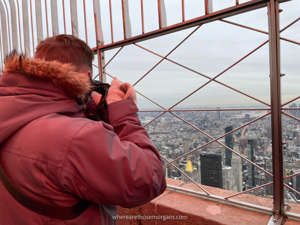 Mark taking a photo from the 86th floor