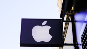 Apple (AAPL) logo brand and text sign on entrance facade store American multinational boutique corporation dealership shop