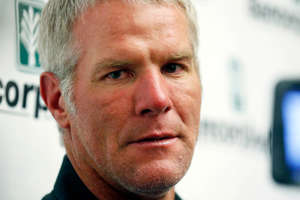 Former NFL quarterback Brett Favre speaks with reporters prior to his induction to the Mississippi Hall of Fame in Jackson, Miss., on Aug. 1, 2015.