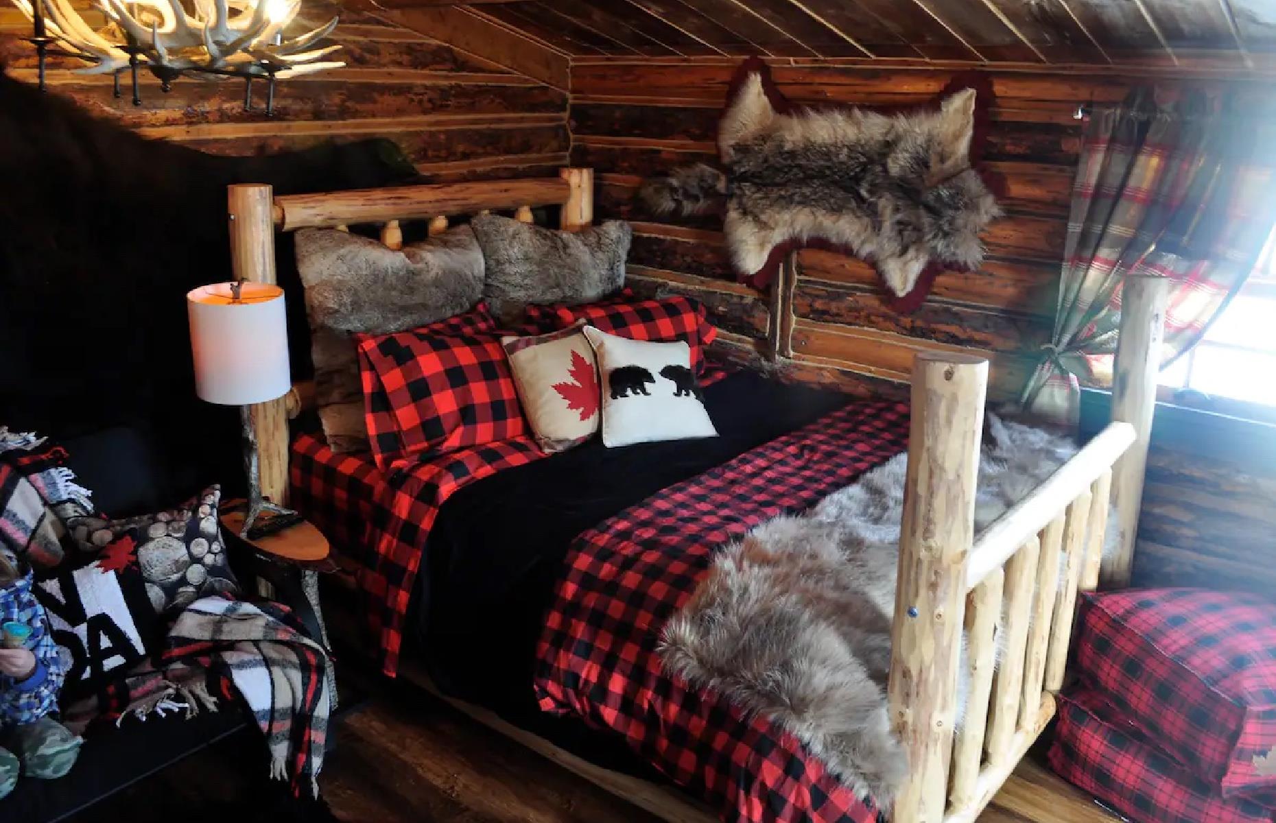<p>Relax among foothills of the Rocky Mountains in this postcard-worthy log cabin near rugged Ghost Lake, Alberta. This <a href="https://www.airbnb.co.uk/rooms/33159588?adults=1&category_tag=Tag%3A5348&children=0&infants=0&check_in=2022-10-19&check_out=2022-10-26&federated_search_id=ebcde463-87b0-4421-9477-ab875a95438e&source_impression_id=p3_1662855390_gaa9w9svQ9tUsrAJ">historic hut</a> was used as a fur trading post over 100 years ago and it still retains that frontier charm, with animal fur decor, a wood-burning stove and buffalo check bedding. You won’t be living like a pioneer, though – there is a bathroom in the cabin along with enough space for four guests to chill with each other after a hike or a winter skate on the lake.</p>
