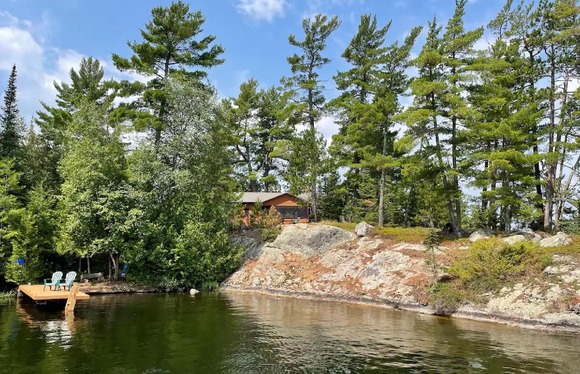 <p>Nym Island sits on its namesake lake in remote western Ontario. Located at the gateway to Quetico Park, this raw wilderness is favored by canoeists who want to immerse themselves in a quintessential central-Canadian adventure. This <a href="https://www.airbnb.co.uk/rooms/612284806617143763?adults=1&category_tag=Tag%3A675&children=0&infants=0&check_in=2023-05-18&check_out=2023-05-24&federated_search_id=995de101-3afa-4107-9679-c677bc012ed3&source_impression_id=p3_1662854465_anbwov2UKE212sXe">private six-person cabin</a> is appropriately rustic with voyageur-inspired details and a lakefront fire pit and private dock, perfect for watching the sunset or the impossibly dark night sky.</p>