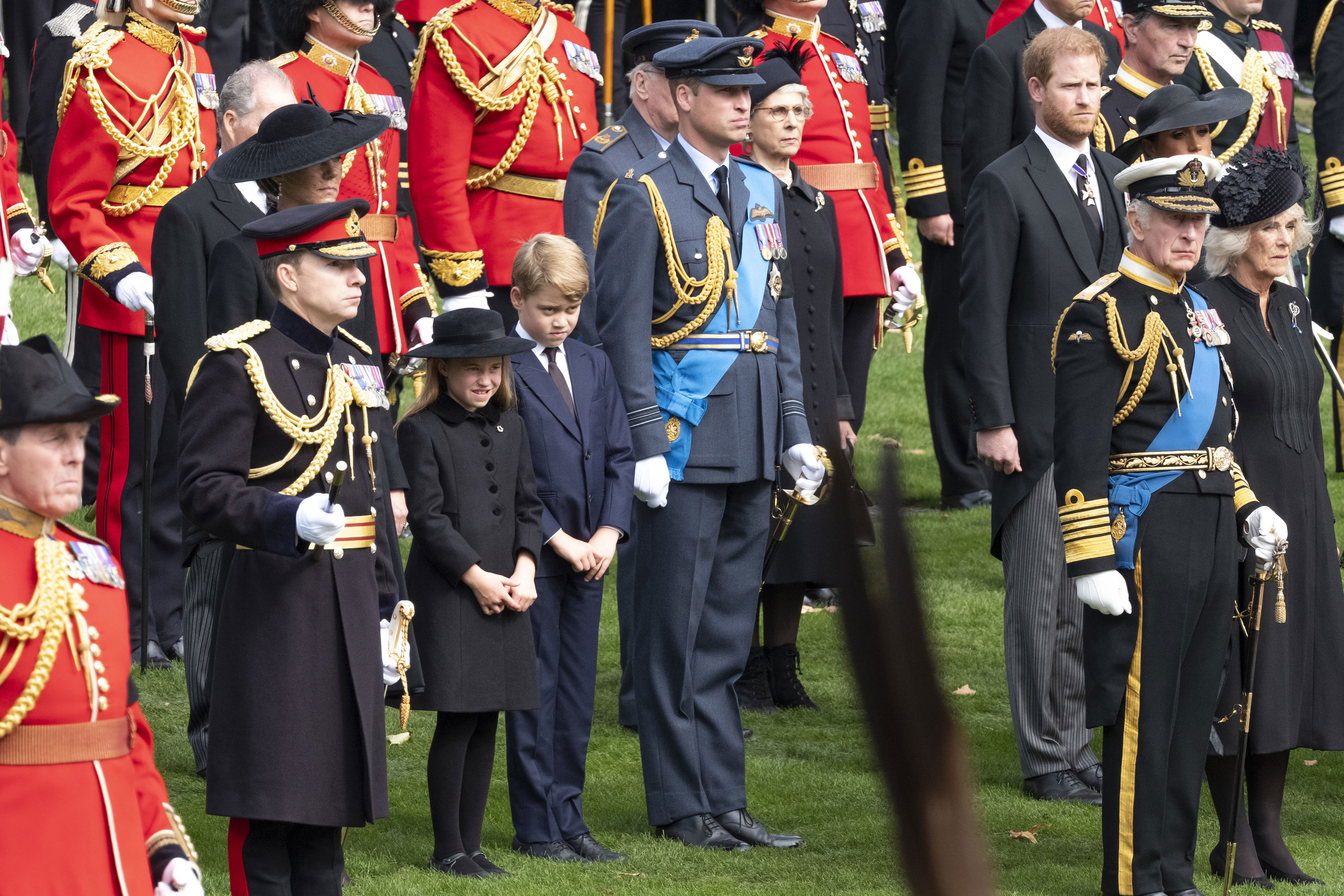 <p>Britain's King Charles III and wife Camilla, Queen Consort; Prince William, Prince of Wales and wife Catherine, Princess of Wales and their kids, Prince George and Princess Charlotte; and Prince Harry, Duke of Sussex and wife Meghan, Duchess of Sussex watched as the coffin of the late Queen Elizabeth II arrived at Wellington Arch from Westminster Abbey in London on Sept. 19, 2022, before being driven to Windsor, England, <a href="https://www.wonderwall.com/celebrity/royals/best-photos-from-queen-elizabeth-ii-funeral-king-charles-princes-william-prince-harry-george-charlotte-kate-meghan652347.gallery">for her burial</a>.</p>