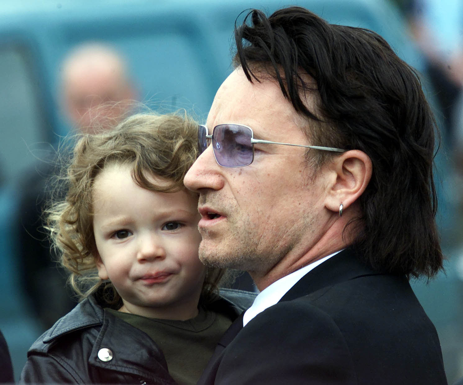 <p>U2 frontman Bono carried his then-2-year-old son with wife Ali Hewson, Elijah, into the Church of Assumption in Howth, Ireland, for the funeral of his father on Aug. 24, 2001. Keep reading to see Eli now...</p>