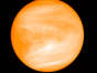 Despite being farther from the Sun than Mercury, Venus is hotter than Mercury because its carbon dioxide and sulfuric acid-filled atmosphere causes a greenhouse effect.