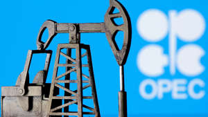 A 3D-printed oil pump jack is seen in front of the OPEC logo in this illustration picture, April 14, 2020. REUTERS/Dado Ruvic/File Photo