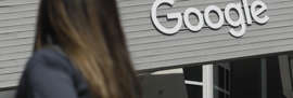 FILE - A woman walks past a Google sign on campus in Mountain View, California, in this file photo September 24, 2019. The political tech industry's fortunes have changed since Barack Obama and Joe Biden left the White House. Facebook, Google, Amazon and Apple have come under fire from Congress, federal regulators, prosecutors and European authorities. (AP Photo/Jeff Chew, archive)