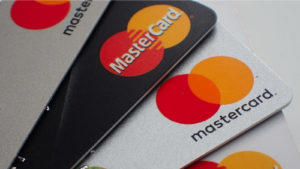 Close up of a pile of mastercard credit load debit bank cards.