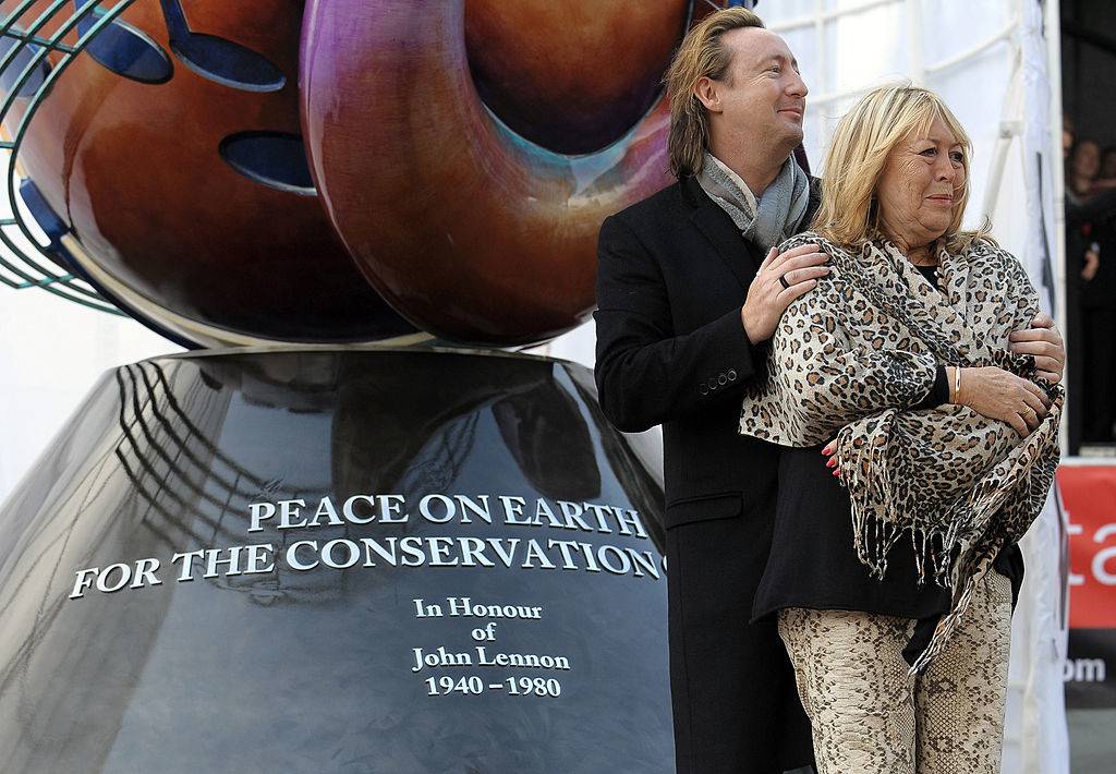 <p>Also in 2010, Julian joined his mother Cynthia in the unveiling of the John Lennon Peace Monument in Liverpool. The beautiful, 18-foot sculpture is a colorful sphere covered with music notes and peace signs and topped with silver birds.</p> <p>It reads "Peace On Earth For The Conservation Of Life In Honour of John Lennon 1940-1980." Julian said at the ceremony, "We come here with our hearts to honor Dad and pray for peace and say thank you to everybody who is celebrating today."</p>