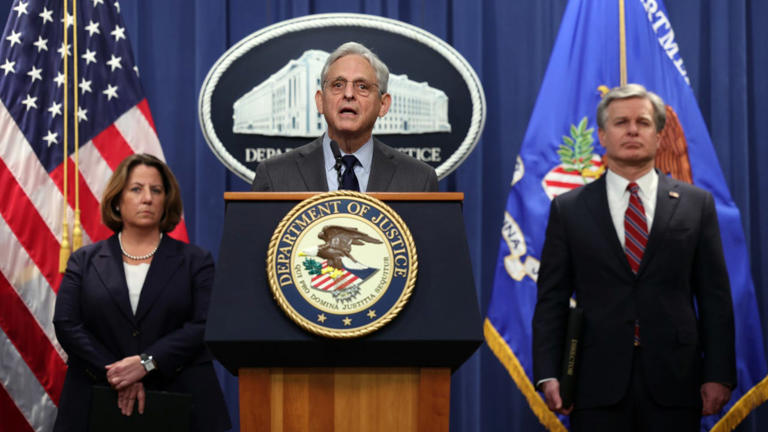 U.S. Attorney General Merrick Garland (C), F.B.I. Director Christopher Wray (R) and Deputy Attorney General Lisa Monaco hold a press conference at the U.S. Department of Justice. Getty Images