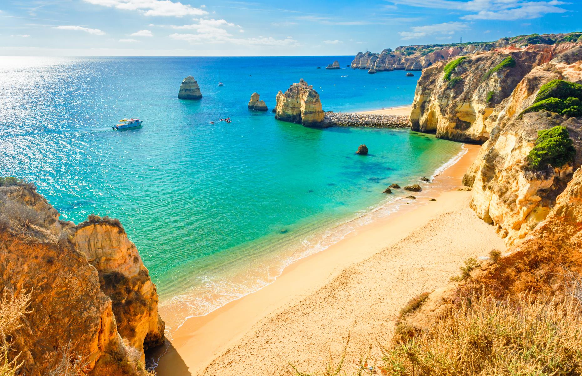 <p>Portugal has long been a summer vacation staple, and its appeal ranges from the <a href="https://www.loveexploring.com/news/78752/the-eastern-algarve-7-reasons-to-visit-portugals-bestkept-secret">beaches of the Algarve</a> and the mountains <a href="https://www.loveexploring.com/news/83327/6-reasons-to-visit-centro-de-portugal">in the country's center</a> to the fabled <a href="http://www.loveexploring.com/guides/69830/what-to-do-in-lisbon-tourist-attractions">Lisbon Old Town</a> and historic <a href="https://www.loveexploring.com/guides/66209/what-to-do-in-porto">city of Porto</a>. Food is one of Portugal's best-known assets. Be sure to try the famous custard tarts, pastéis de nata, fresh seafood and native wines. For the ultimate guide to the different areas of Portugal, <a href="https://www.loveexploring.com/guides/73966/the-best-places-to-visit-in-portugal-by-region">take a look here.</a></p>