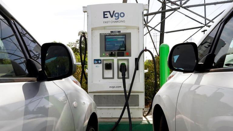 Electric cars are parked at a charging station in Sacramento, Calif., Wednesday, April 13, 2022. AP Photo/Rich Pedroncelli, File