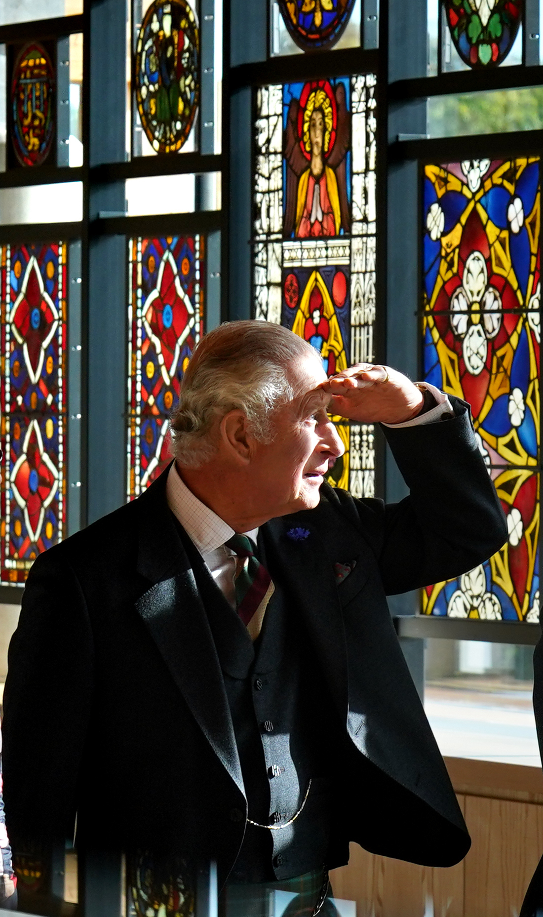 <p>King Charles III peered through the stained-glass windows at the Burrell Collection at Pollok Country Park in Glasgow, Scotland, on Oct. 13, 2022, following a six-year refurbishment project.</p>