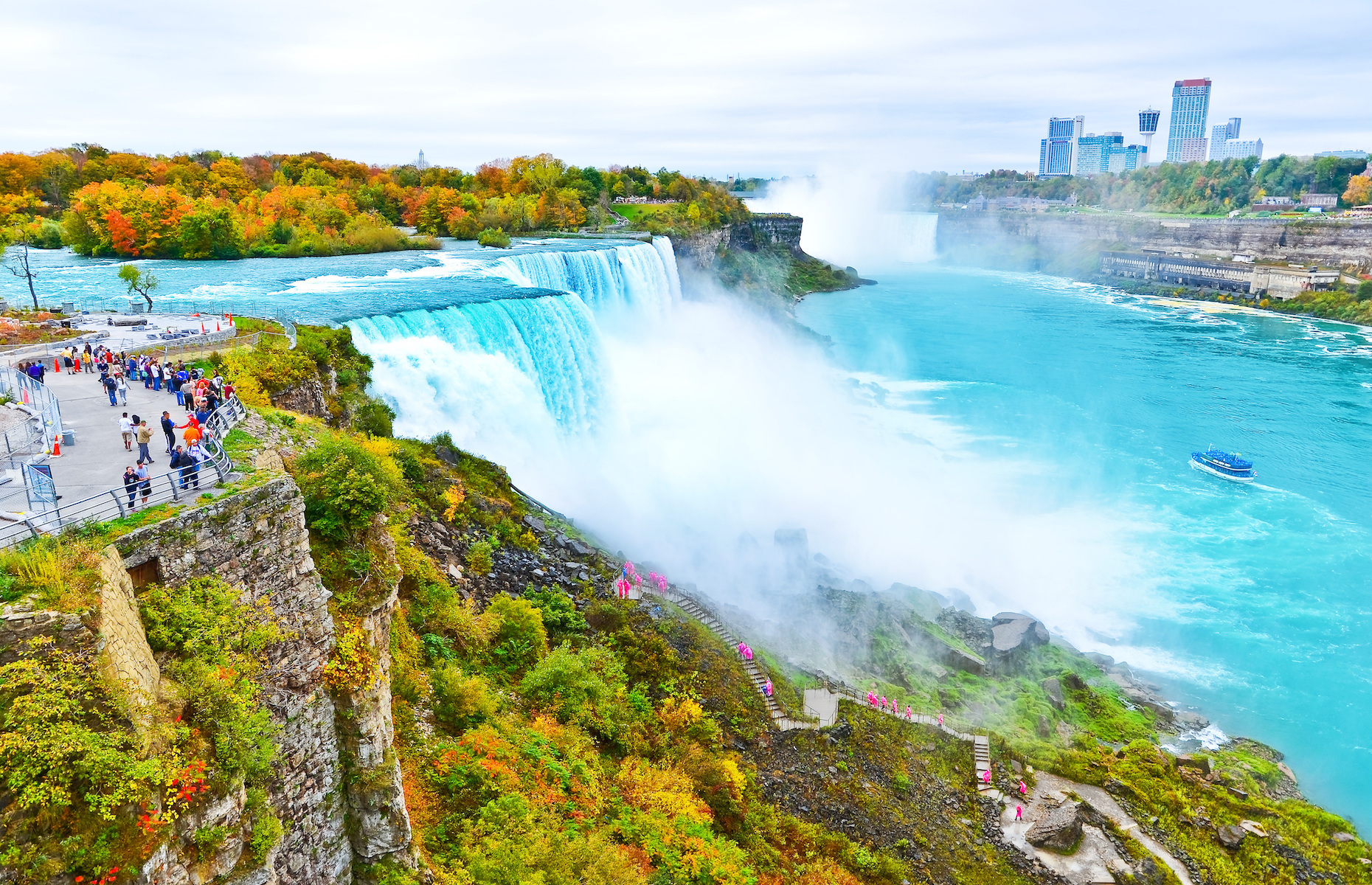 <p>The Niagara Falls, located on the Canada–United States border, are a preeminent attraction that draws tourists from both countries. The autumn display is even more impressive. <a href="https://www.niagarafallstourism.com/seasons/autumn/" rel="noreferrer noopener">Primarily composed of maple trees, the woods and parks near the falls blaze with red and orange hues.</a></p>
