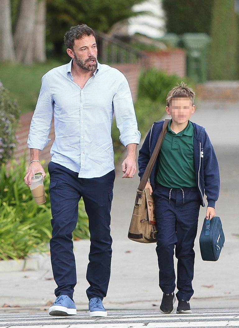 Newlywed Ben Affleck enjoys his iced coffee as he takes his son Samuel to school. The two took their stroll in the middle of September, shortly after Ben married Jennifer Lopez for the second time. 
