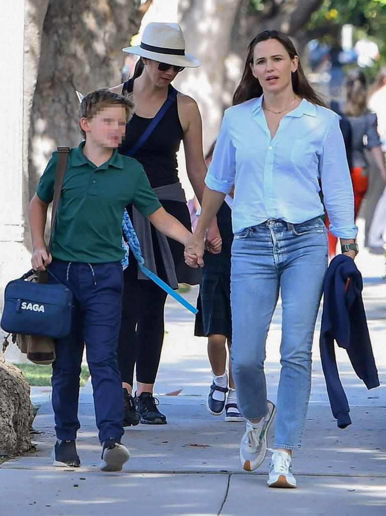 Jennifer Garner was seen walking her youngest child with Ben Affleck, son Samuel, 10, home from school in Santa Monica on Oct. 19, 2022. Samuel looked adorable in his school uniform, while the actress wore jeans and a button-down blouse.