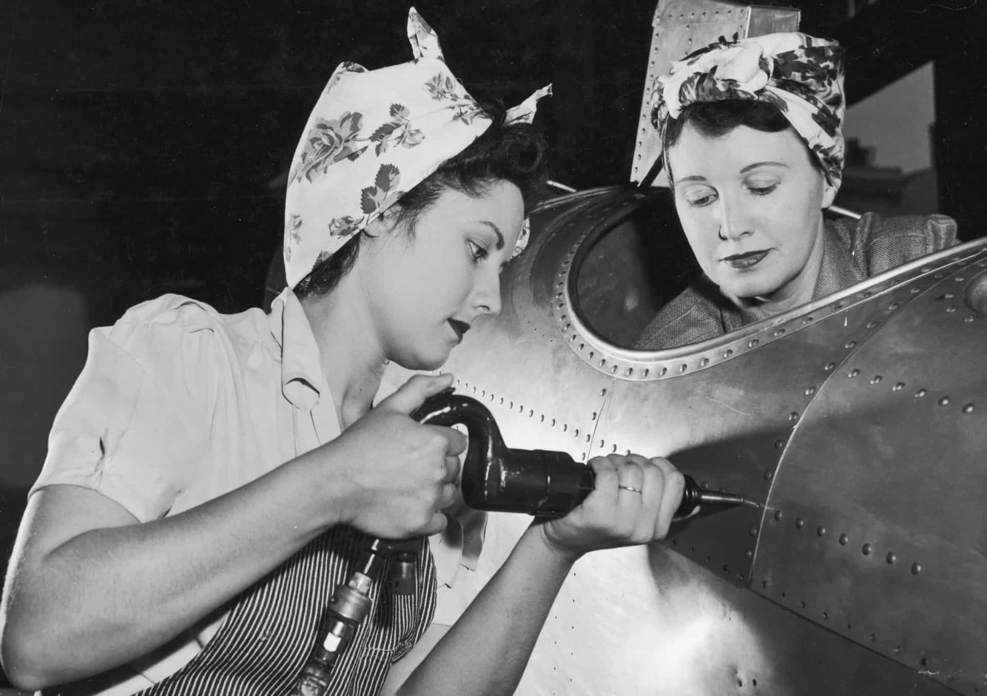 <p>An American female worker drives rivets into an aircraft while another sits in the cockpit checking they've been securely fastened. The women wear aprons and their hair is tucked into scarves. A woman who went to work in industries to aid the war effort and was assigned this particular role became affectionately known as Rosie the Riveter.</p><p>You may also like:<a href="https://www.starsinsider.com/n/177433?utm_source=msn.com&utm_medium=display&utm_campaign=referral_description&utm_content=517253en-us"> 11 cities around the world that may run out of water</a></p>