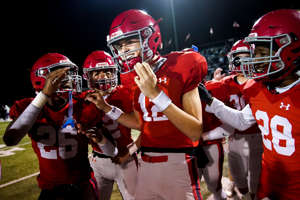 Brentwood Academy's George Macintyre (12) celebrates with teammates after defeating Pope John Paul II in a Division II-AAA quarterfinal at Brentwood Academy in Brentwood, Tenn., Friday, Nov. 11, 2022.