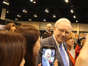 Fans of Warren Buffett taking his photo