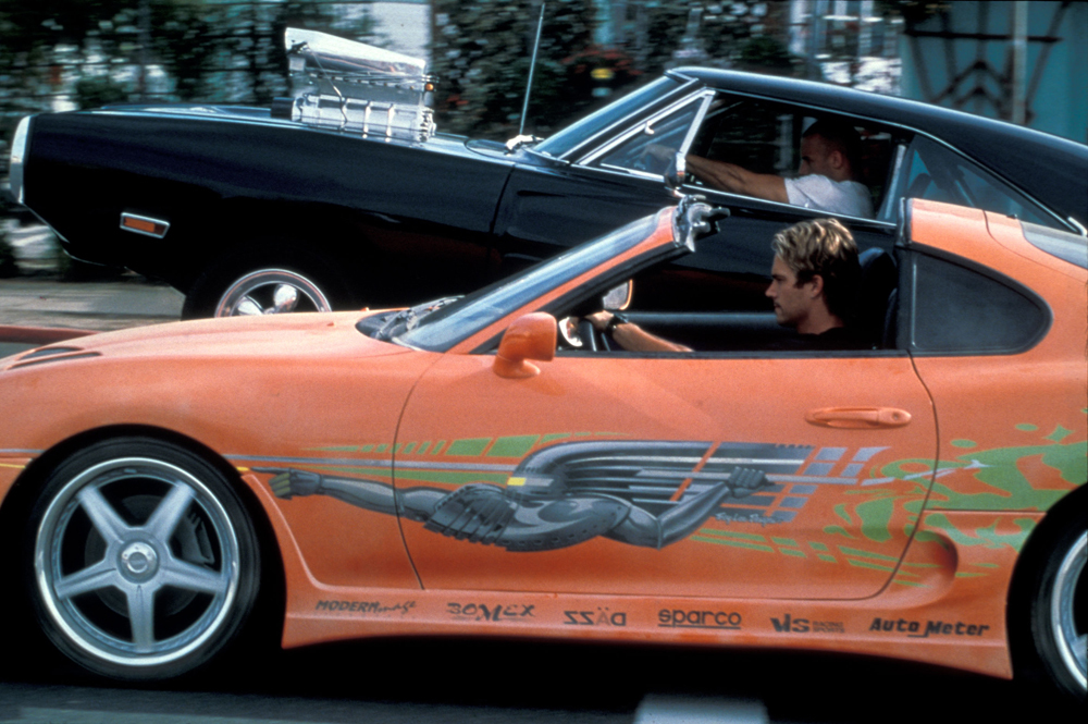 <p>There was only one car that could compete with Vin Deisel's classic muscle car, and it was this 1995 Toyota Supra Turbo MKIV. The two stars of the movie squared off in an emotional race, then Paul Walker's character offers him the keys so he can flee the scene after Dom crashes.</p> <p>Not only did this Supra have slick pieces of vinyl and a clean orange coat, but it was also incredibly fast. With a few performance mods, it was able to keep up with the Deisel's Dodge.</p>