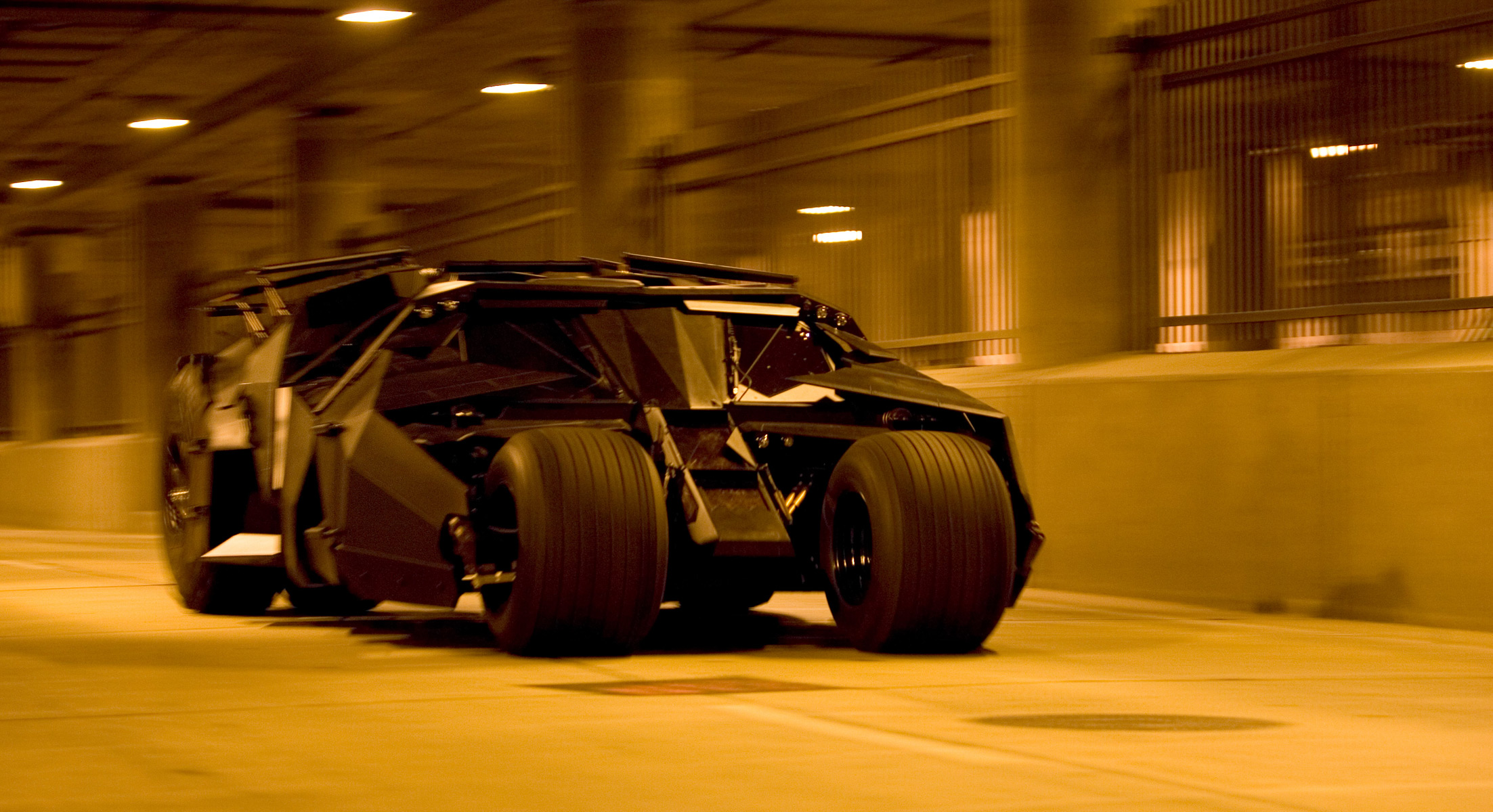 <p>Like the Bond cars, Batmobiles have transcended for many generations. But the militaristic Batmobile Tumbler first appeared in Christopher Nolan's <i>Batman Begins</i> and <i>The Dark Knight</i>. The beefy 350-cid Chevy V8-cylinder powers the tank-like Tumbler to reach a speed of 60 mph in five seconds.</p> <p>The front tires on this custom Batmobile are mounted to an independent suspension with 30 inches of suspension travel. What makes the Tumbler stand out compared to many movie props these days is that it's a real thing. In no way or form is the car a computer-animated fantasy.</p>