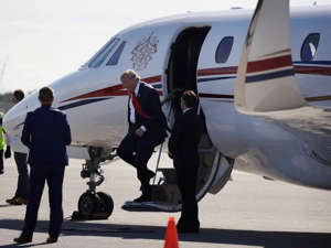 Trump stepping off the Cessna Citation X. John Locher/AP Images