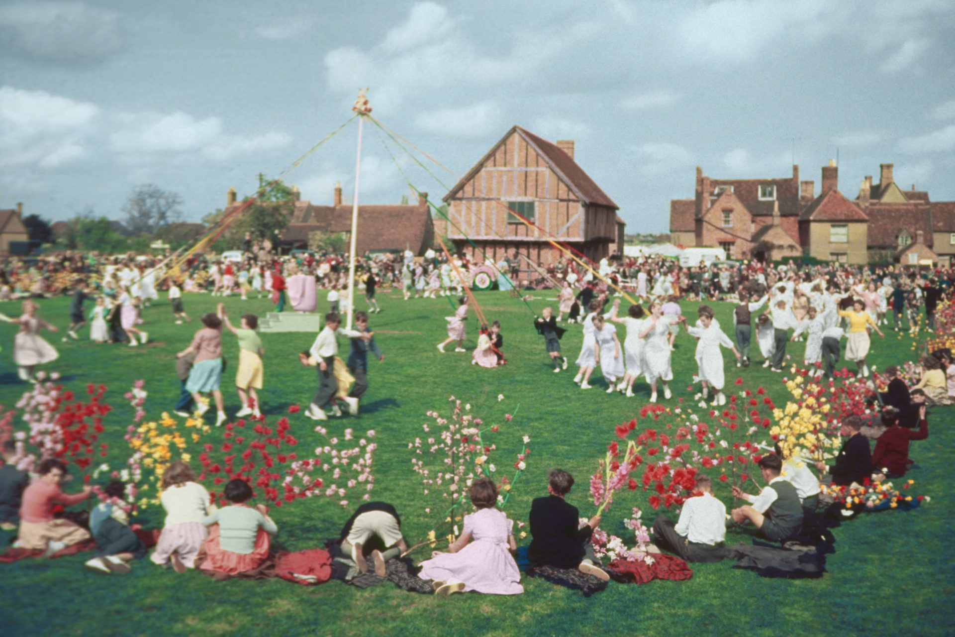 Strange British traditions. May Day in great Britain with singing and Dancing Round a Maypole..