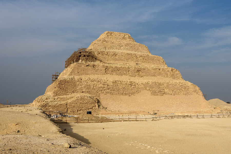 <p>Northwest of Memphis, the Pyramid of Djoser is believed by the scientists to be the oldest Egyptian pyramid. Erected during the 27th century BC, the pyramid is surrounded by a courtyard and ceremonial decorations. According to scientists, the weather-worn building originally stood 203 feet high. Built as a step pyramid, the mudbrick structure contains multiple complex structures.</p> <p>Inside the tomb is a burial chamber ravaged by time. When archaeologists discovered the Pyramid of Djoser one of the first things they noticed was no body was inside. Although used as the tomb of King Djoser, the structure is void of treasure from years of looting.</p>
