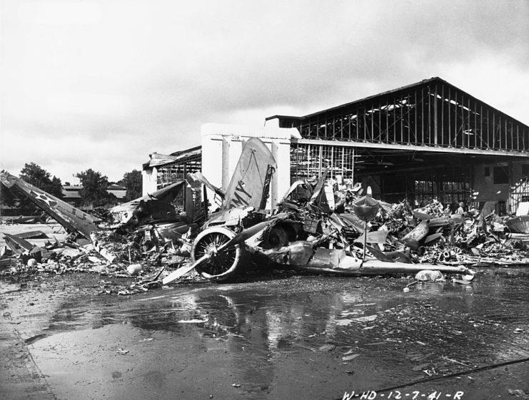 <p>Damaged aircraft at Wheeler Airfield following the attack. The location was the first hit during the bombardment, in an attempt to prevent American aircraft from taking to the air and launching a counterattack against the Japanese. While the majority were destroyed, 12 pilots did start up their Curtiss P-36 Hawks and <a href="https://www.warhistoryonline.com/instant-articles/the-curtis-p-40-warhawk.html" rel="noopener">P-40 Warhawks</a> and engaged the enemy in fierce dogfights.</p>