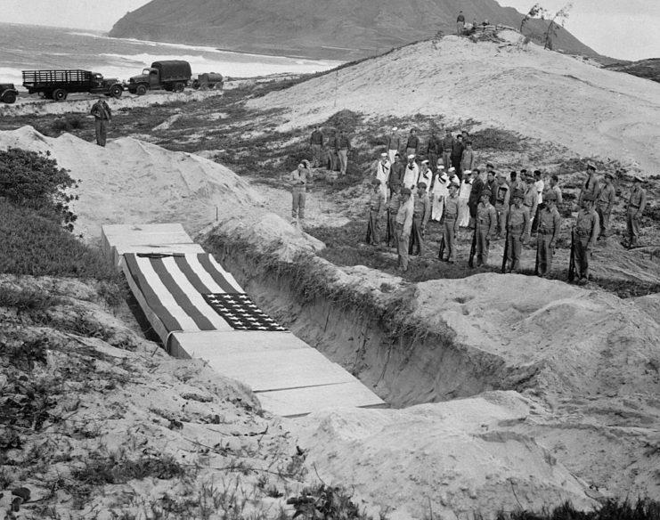<p>Military personnel paying their respects to some of the servicemen killed during the attack on Pearl Harbor - as aforementioned, 2,335 perished. The caskets are draped in the American flag, as is tradition for military funerals.</p>