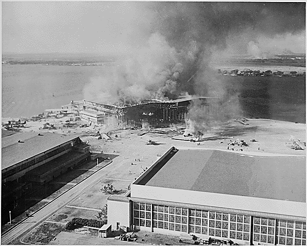 <p>Soldiers' barracks ablaze on Ford Island following the Japanese attack. Along with the ships anchored at Pearl Harbor's Battleship Row, a number of structures and American aircraft were targeted in the enemy bombardment.</p>