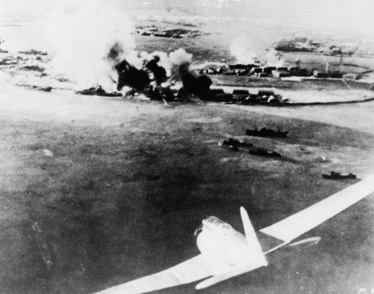 <p>This photo, taken by a Japanese pilot, shows aircraft flying toward Pearl Harbor. The bomber is loaded with explosives, which its pilot will drop on sea vessels and other aircraft throughout the course of the attack on the naval base.</p>