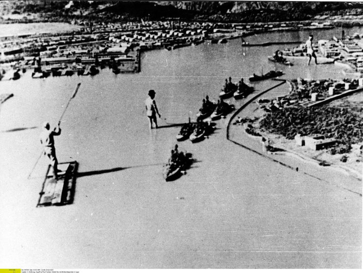 <p>To plan the attack on Pearl Harbor, the Japanese military created a large-scale model of the American naval base. In this photo, you can see how extensive the mock-up is, including the battleships anchored off-shore.</p>