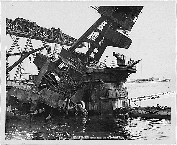 <p>The <a href="https://www.warhistoryonline.com/instant-articles/uss-arizona-1177-lives-lost-during-the-attack-on-pearl-harbor.html" rel="noopener">USS <em>Arizona</em></a> (BB-39) was one of the battleships to suffer extensive damage. Records show that 1,177 of the vessel's crewmen perished during the attack on Pearl Harbor, accounting for nearly half of the 2,400 total deaths from that day. This photo features a close-up of the top of <em>Arizona</em>'s turret, as well as her conning tower and foremost structure.</p>