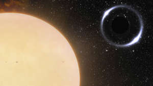 This illustration provided by NOIRLab in November 2022 depicts the closest black hole to Earth and its Sun-like companion star. The binary system, about 1,600 light years from Earth, was initially identified using the European Space Agency's Gaia spacecraft. Astronomers followed up with the International Gemini Observatory in Hawaii to confirm their findings. (International Gemini Observatory/NOIRLab/NSF/AURA/J. da Silva/Spaceengine/M. Zamani via AP)